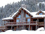 Gallatin Gateway, MT Custom Log Home With Snow