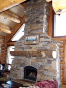 Rock fireplace handcrafted with log mantle, bozeman, mt